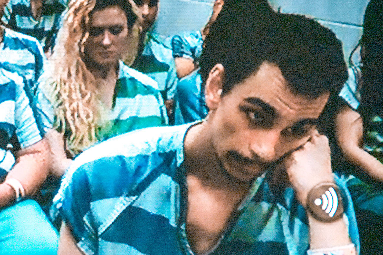 Zachary Madding, 28, right, is accused of holding down his girlfriend at a Mukilteo motel, to force Xanax down her throat and fentanyl into her nose. Police arrested him for investigation of attempted murder. (Caleb Hutton/The Herald)