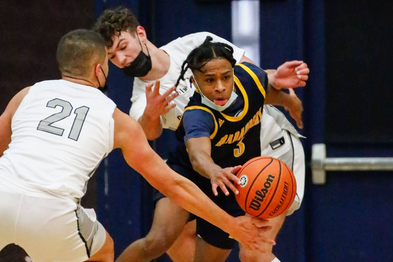 Mariner's Jailin Johnson chases down a loose ball through Glacier Peak's defense Thursday evening at Glacier Peak High School in Snohomish on May 27, 2021. Mariner won 64-36. (Kevin Clark / The Herald)