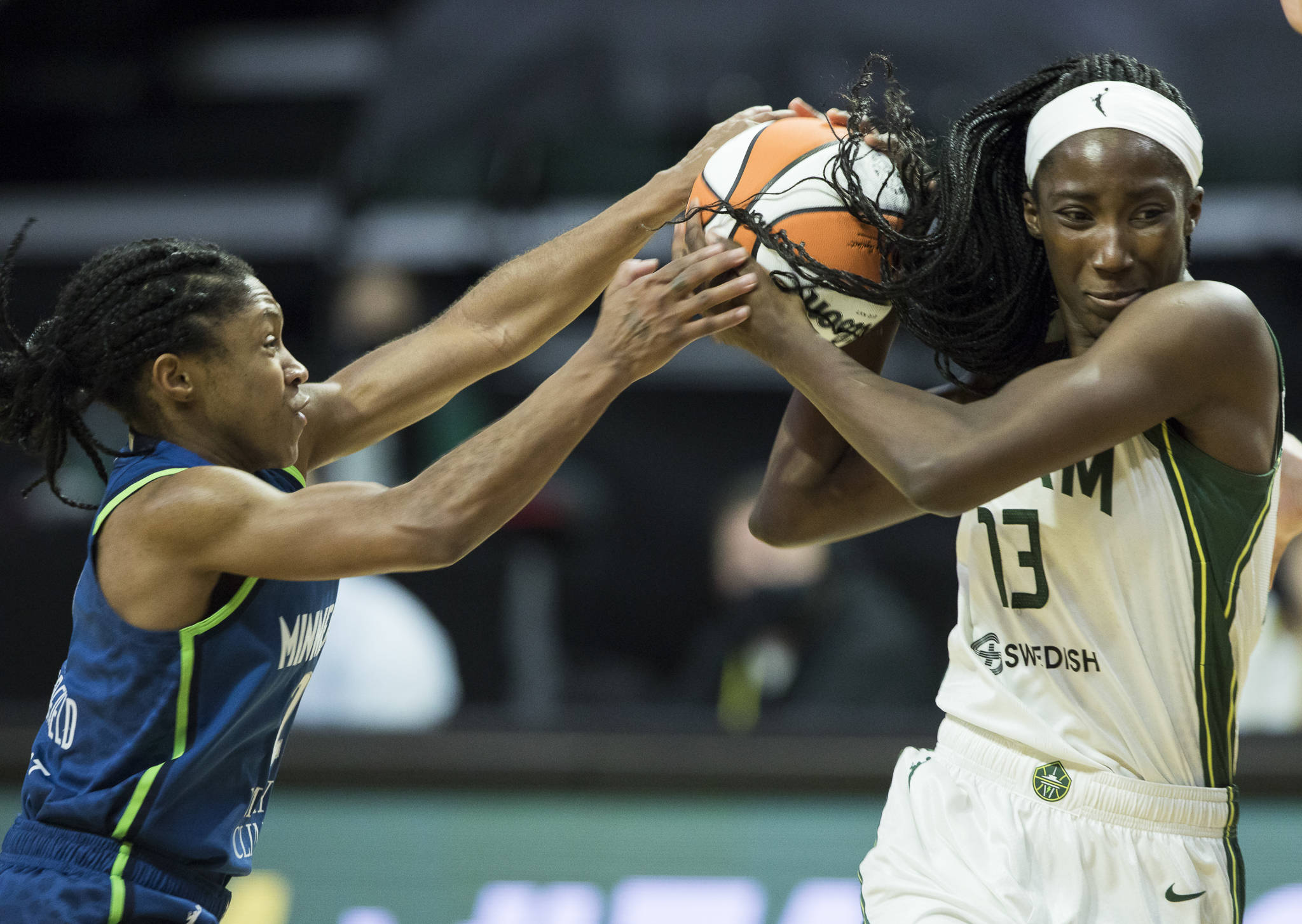 Minnesota Lynx’s Crystal Dangerfield tries to steal the ball from Seattle Storm’s Ezi Magbegor during the game on Friday, May 28, 2021 in Everett, Wash. (Olivia Vanni / The Herald)
