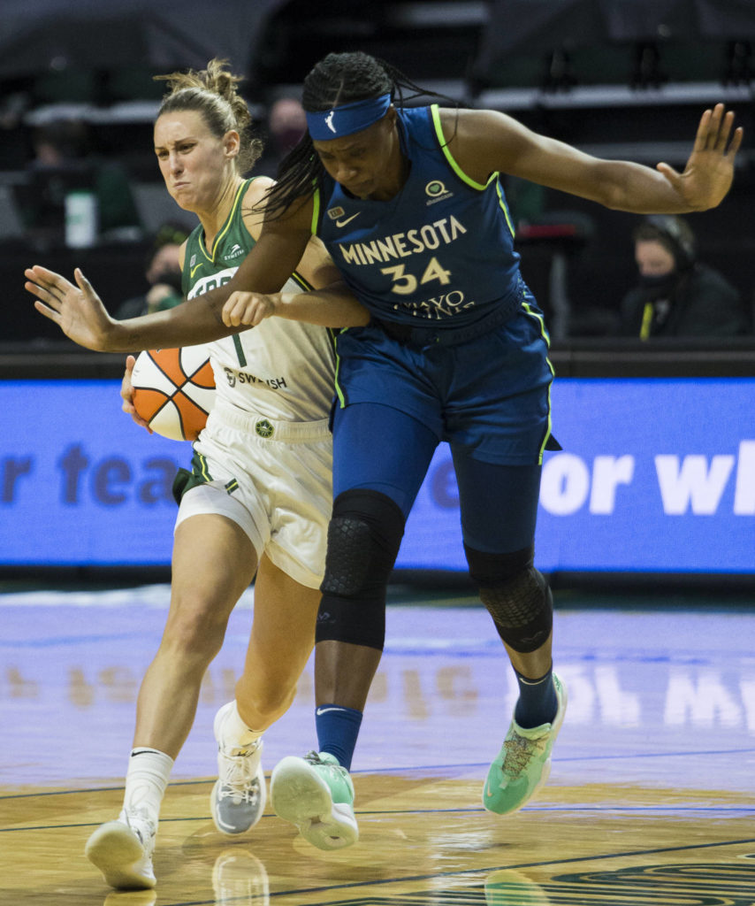 Seattle Storm’s Stephanie Talbot gets fouled by Minnesota Lynx’s Sylvia Fowles during the game on Friday, May 28, 2021 in Everett, Wash. (Olivia Vanni / The Herald)