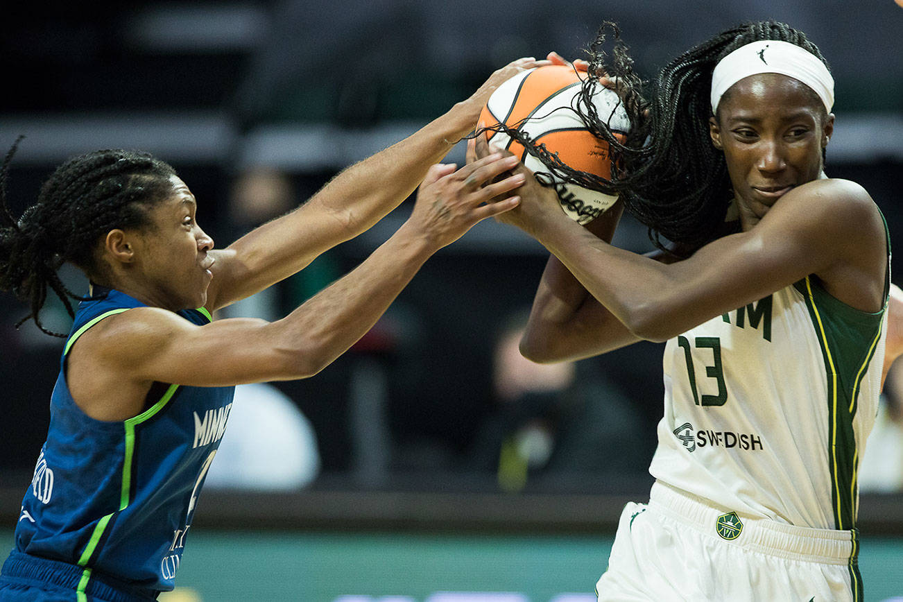 Minnesota Lynx's Crystal Dangerfield tries to steal the ball from Seattle Storm's Ezi Magbegor during the game on Friday, May 28, 2021 in Everett, Wash. (Olivia Vanni / The Herald)