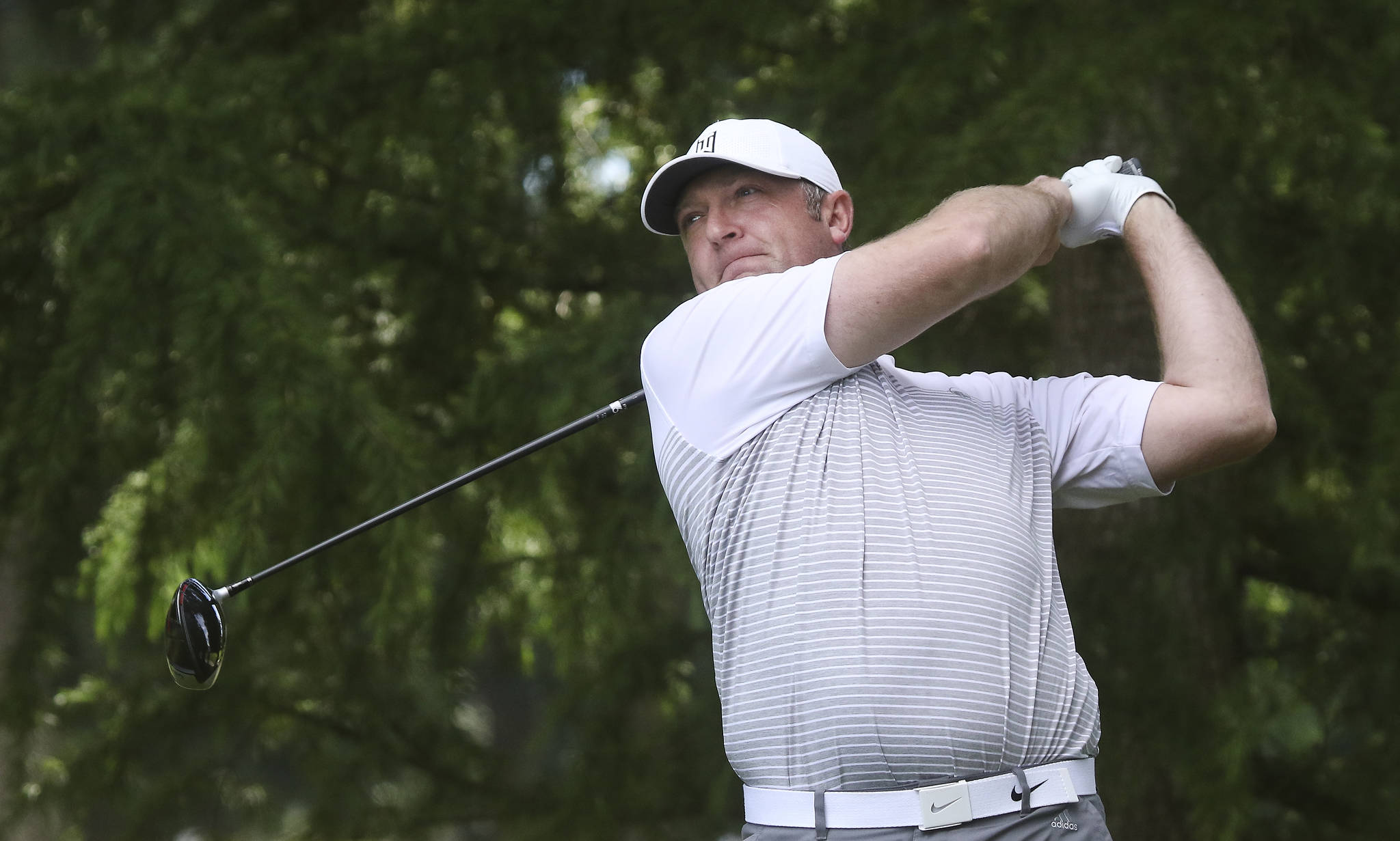 Jacob Rohde tees off during the final round of the Snohomish County Amateur golf tournament at the Everett Golf & Country Club on Monday. (Andy Bronson / The Herald)