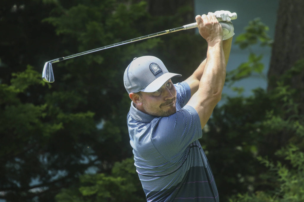 Dominic VanDaveer tees off during the final round Monday. (Andy Bronson / The Herald)
