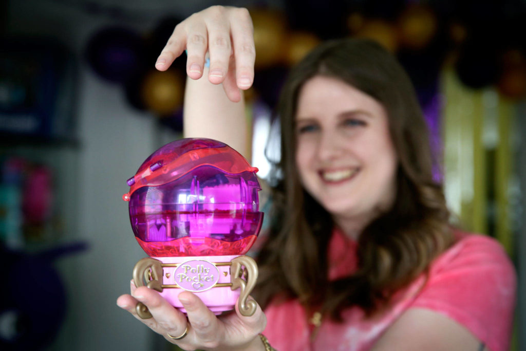 “I love looking at them, I love feeling the nostalgia of them,” Krystyna Roman says of her Polly Pocket collection. (Kevin Clark / The Herald)
