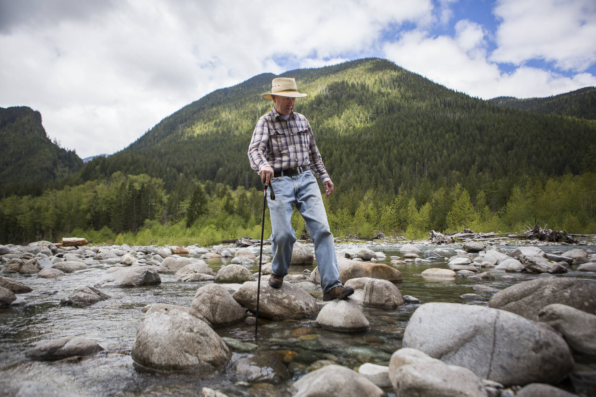 Bruce Kimball navigates his way across one of two river crossings he has to make to connect to Index-Galena Road to reach his cabin on May 9 in Index. (Olivia Vanni / The Herald)