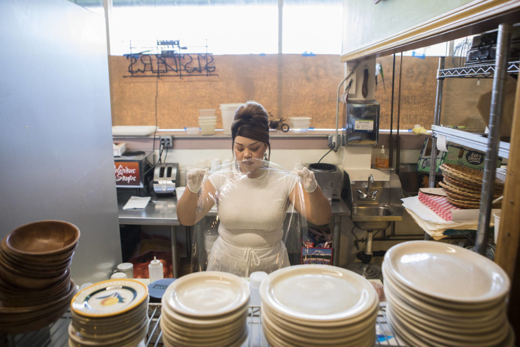 Archie Chandler works in the kitchen of The Sisters Restaurant in Everett. (Olivia Vanni / The Herald) 
