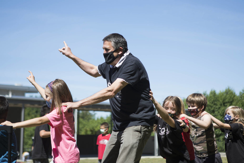 Jeff Thoreson has an outdoor dance party with his second-grade class on Thursday. (Olivia Vanni / The Herald)
