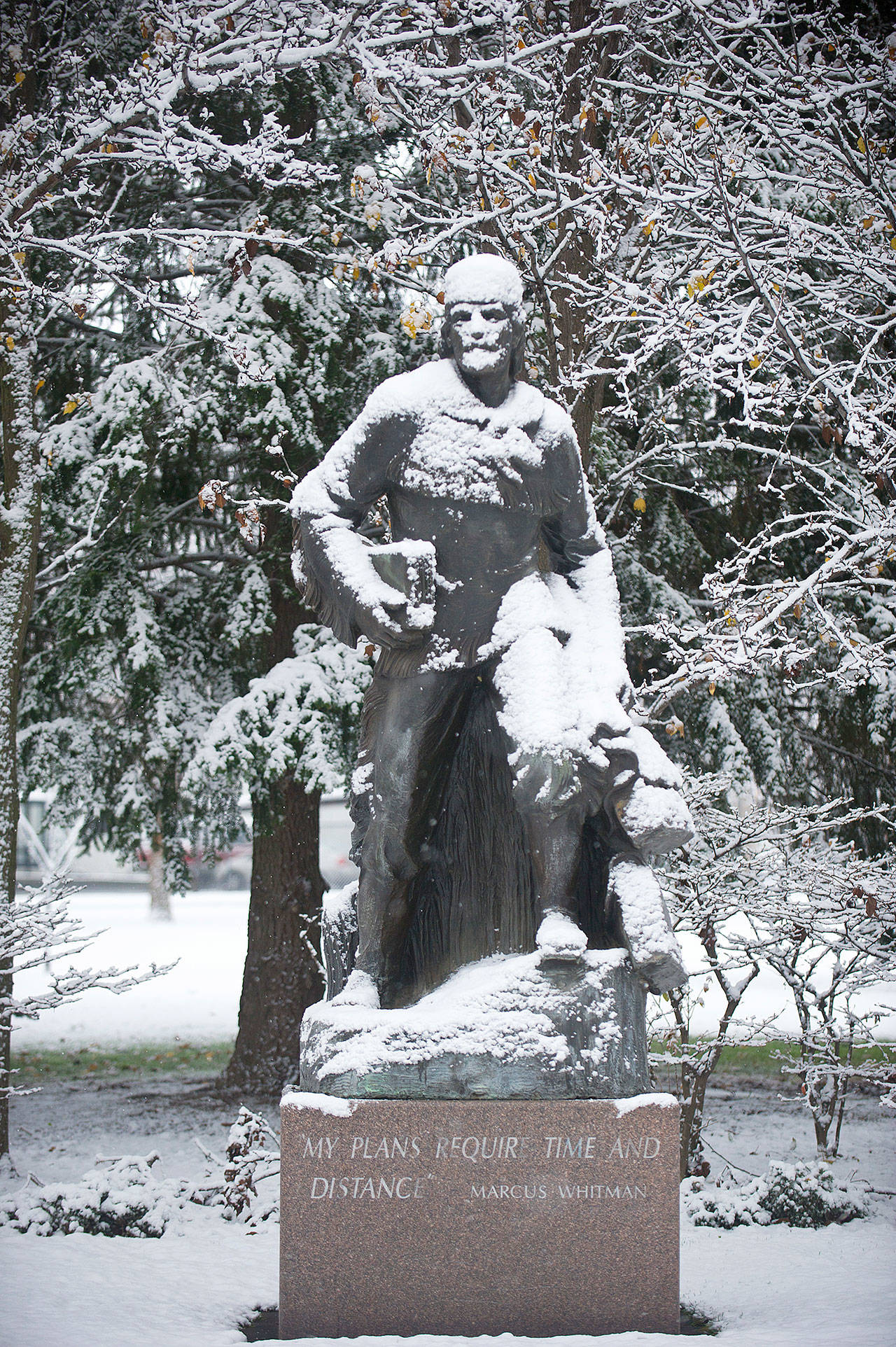 A dusting of snow sits on the statue of Marcus Whitman in Walla Walla in December 2016. The past year has seen the continued reappraisal of Whitman, whose actions are now viewed by many as imperialistic and destructive, and the Washington Legislature voted to remove a similar statue of Whitman from Statuary Hall in Washington, D.C. (Walla Walla Union-Bulletin / via Associated Press)
