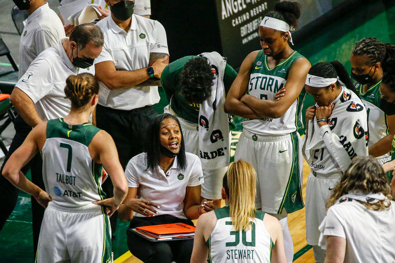 Noelle Quinn, Storm's head coach, runs a timeout huddle Tuesday evening at Angel of the Winds Arena in Everett on June 1, 2021. (Kevin Clark / The Herald)