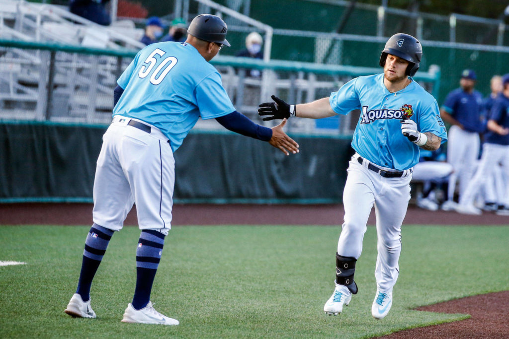 The AquaSox’s Kaden Polcovich rounds third base after hitting a home run during a game against the Hops on Thursday evening at Funko Field in Everett. (Kevin Clark / The Herald)
