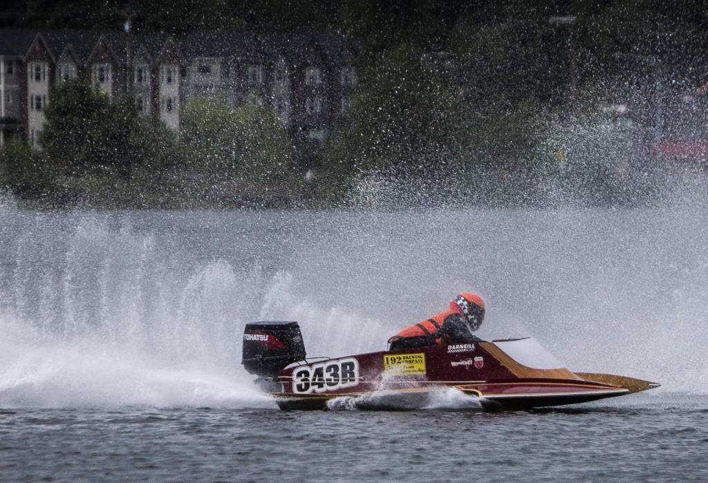 Torei McGregor navigates the first turn while being sprayed by another boats motor on Saturday, June 5, 2021 in Everett, Wash. (Olivia Vanni / The Herald)
