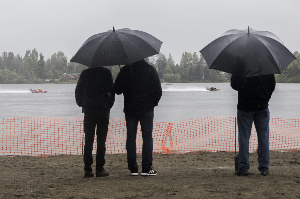 Spectators watch as racers make their way through the starting line on Saturday, June 5, 2021 in Everett, Wash. (Olivia Vanni / The Herald)
