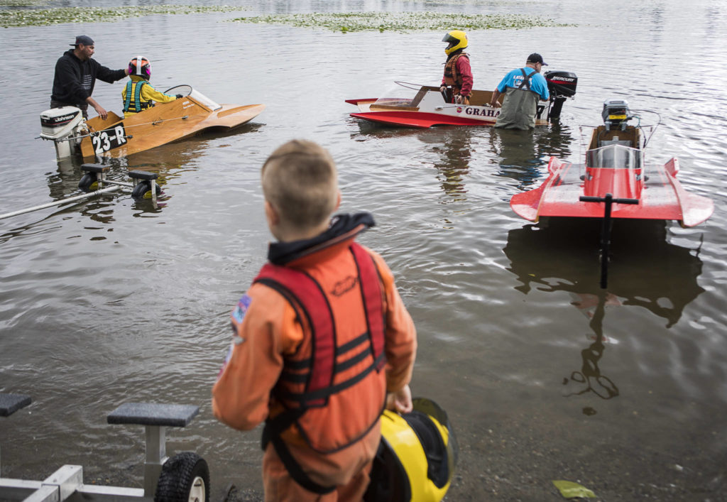 Mini hydroplane racers in the junior class races prepare to head out on the water at Sliver Lake on Saturday, June 5, 2021 in Everett, Wash. (Olivia Vanni / The Herald)
