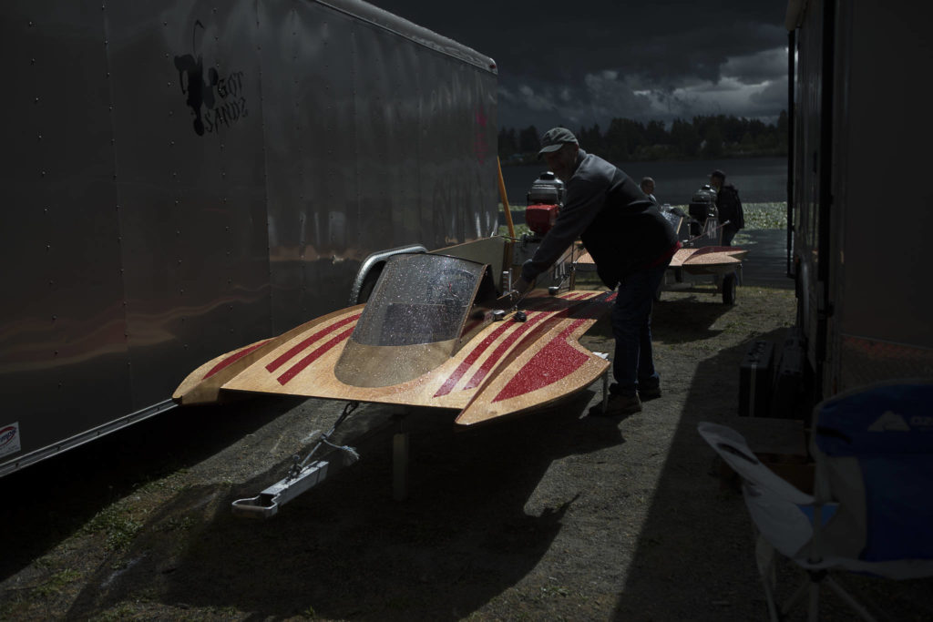 People prep their mini hydroplanes for racing before the start of the Silver Lake Regatta on Saturday, June 5, 2021 in Everett, Wash. (Olivia Vanni / The Herald)
