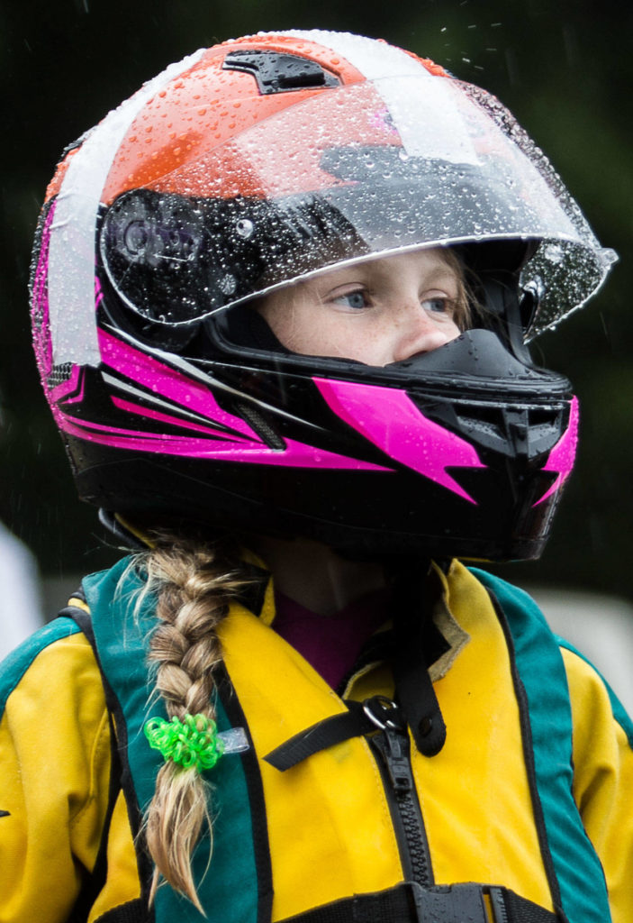 Harper Kelly-Moen watches as racers come into the pits on Saturday, June 5, 2021 in Everett, Wash. (Olivia Vanni / The Herald)
