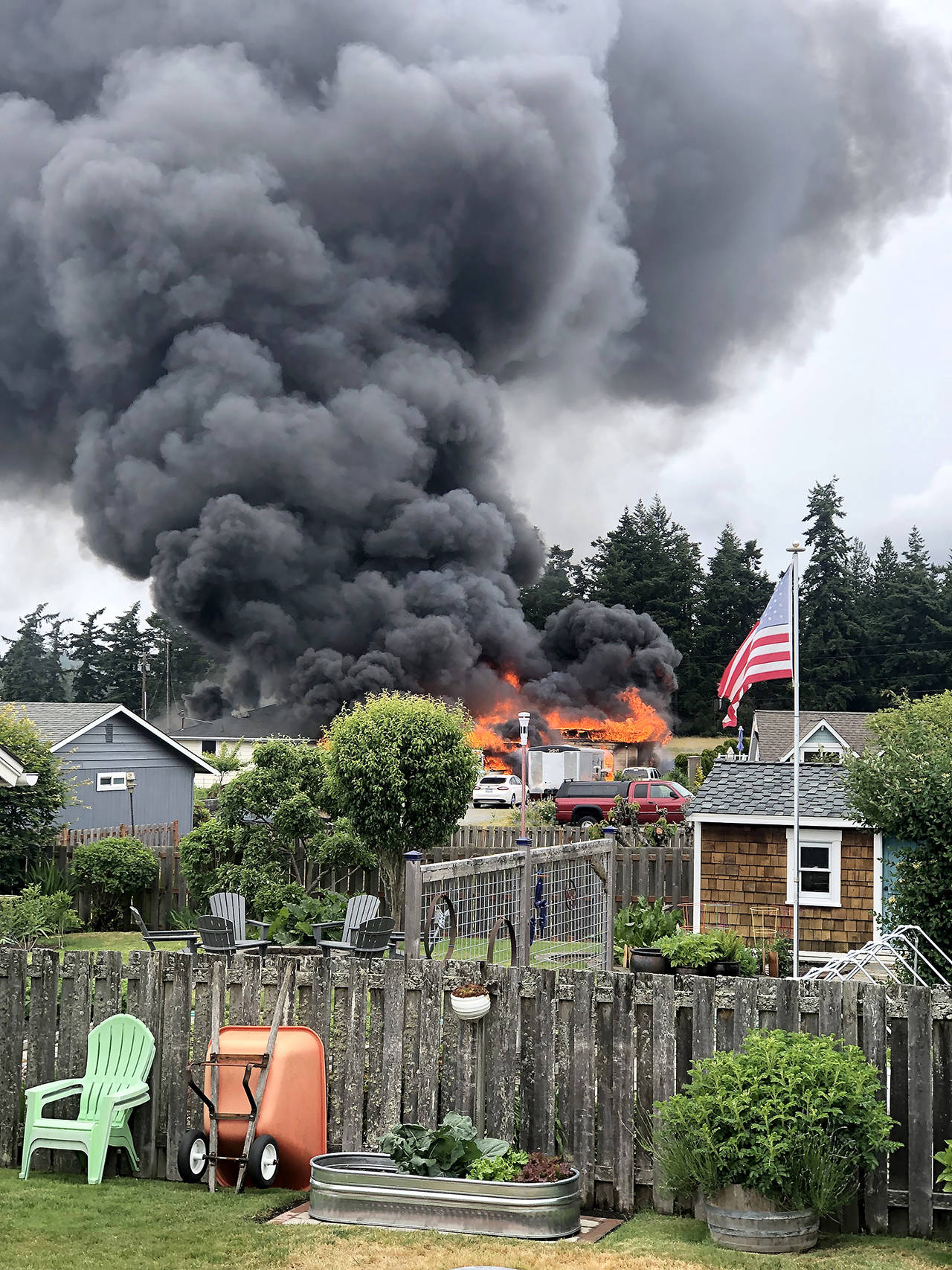 Thick plumes of smoke rose from a house fire Sunday afternoon in the 2000 block of Homestead Avenue in Clinton. (Gregory Doering)