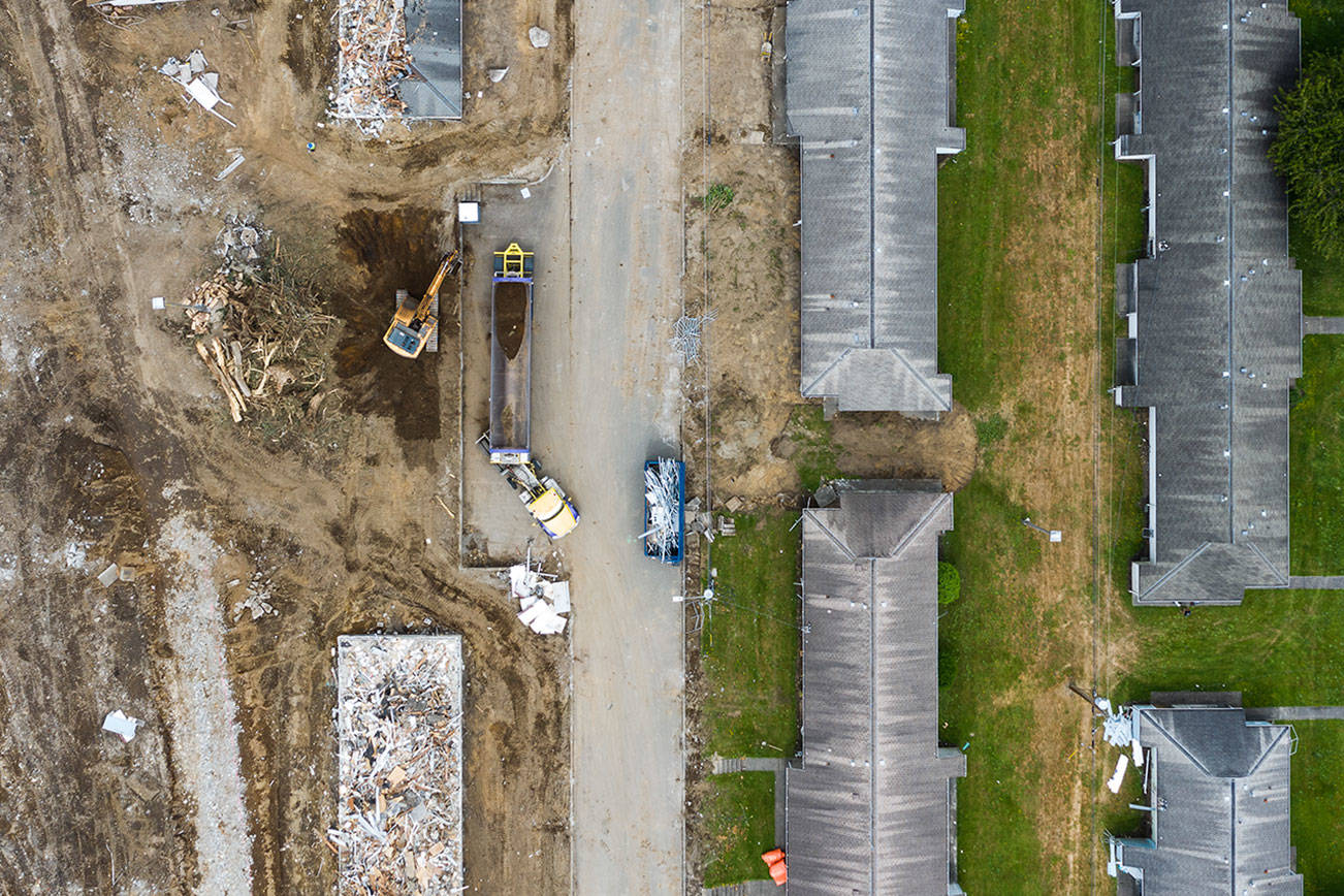 Construction crews demolish public housing  homes at the Baker Heights in Everett’s Delta Neighborhood on Tuesday, June 8, 2021 in Everett, Washington.  (Chuck Taylor / The Herald)