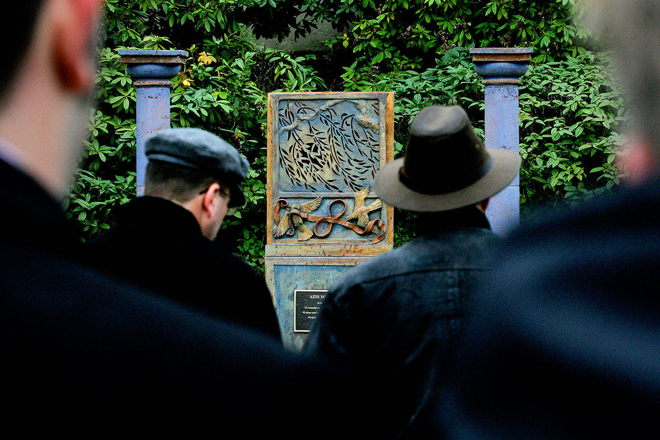 About 50 people attended the dedication of the AIDS Memorial of Snohomish County on Dec. 1, 2005. The memorial is on the west side of the Mission Building on the Snohomish County campus. (Michael O'Leary / Herald file)