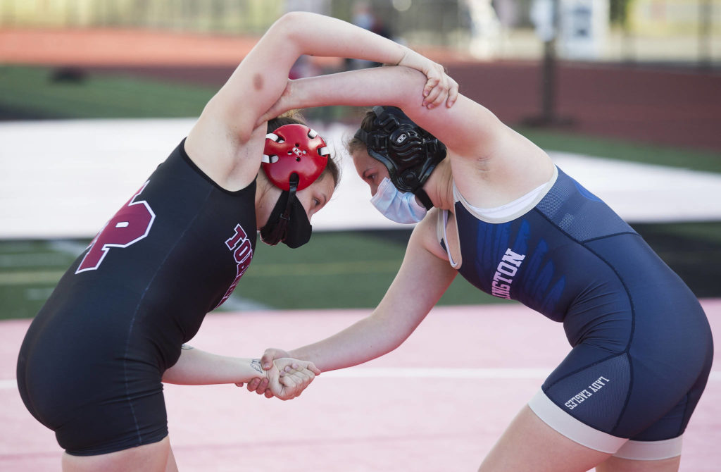 Marysville Pilchuck’s Chelsea Goeden and Arlington’s Raina Allen battle for control as they compete at a girls wrestling scramble held outside at Marysville Pilchuck High School on Tuesday in Marysville. (Andy Bronson / The Herald)
