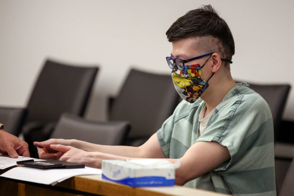 Sira Swope has his finger prints taken after being sentenced to more than six years in prison for a bomb threat and possession of child porn Thursday afternoon at Snohomish County Superior Court in Everett on June 24, 2021. (Kevin Clark / The Herald)
