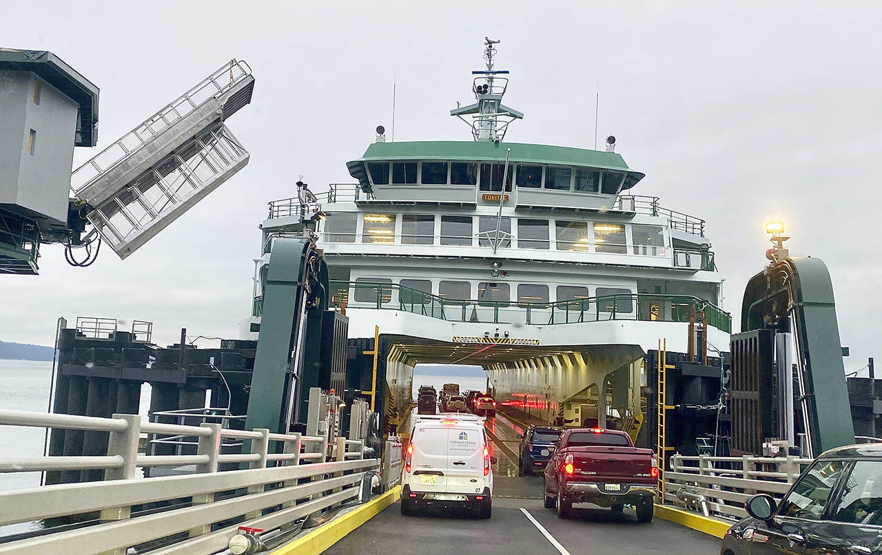 Passengers embark on the Tokitae ferry at the Mukilteo terminal in February. (Andrea Brown / Herald file)