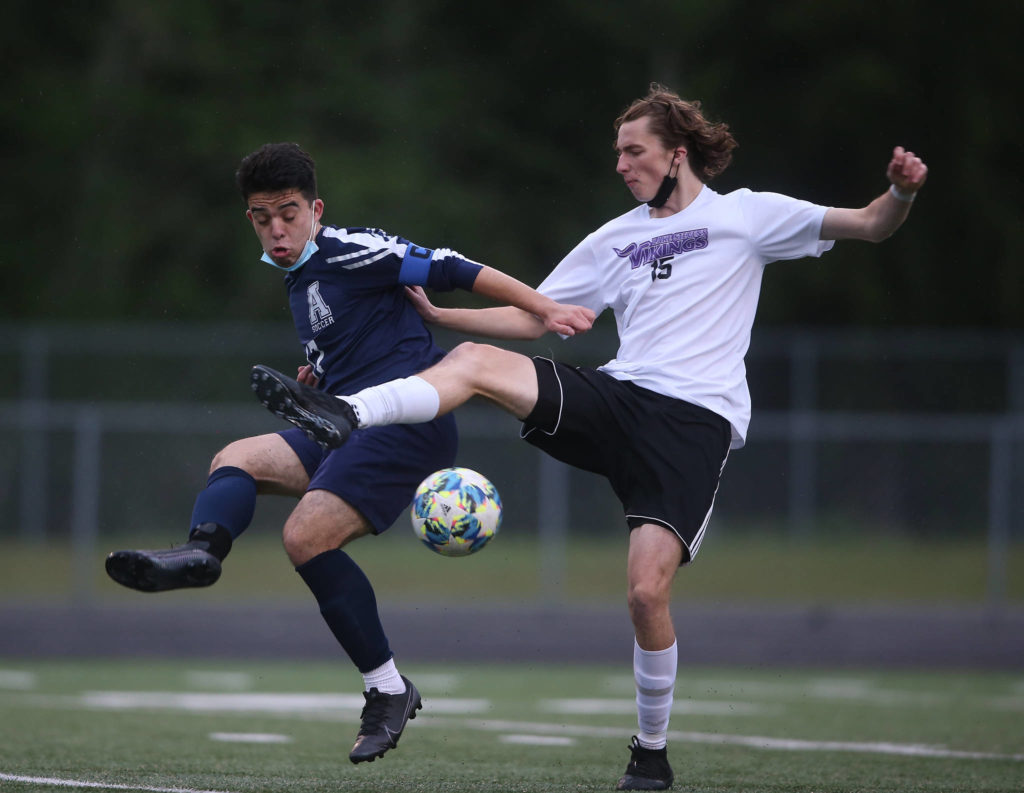 Lake Stevens senior Jordan Ross (right) was named to The Herald’s All-Area boys soccer first team. (Andy Bronson / The Herald)
