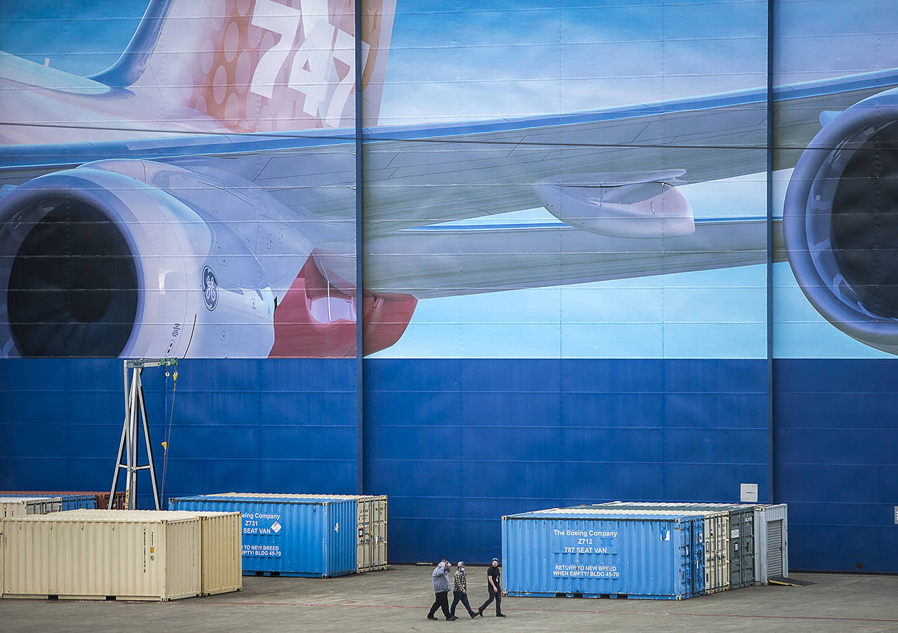 Boeing workers walk outside of Boeing’s Everett assembly plant on April 21, 2020 in Everett. (Olivia Vanni / Herald file)