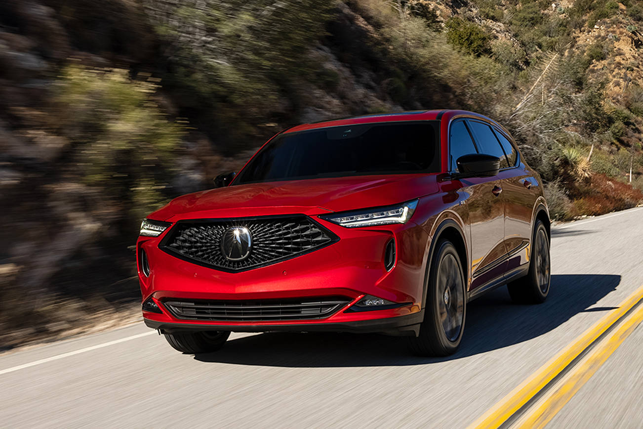 A blacked-out diamond pentagon grille and four-element LED headlights signal assertiveness in the 2022 Acura MDX. (Manufacturer photo)