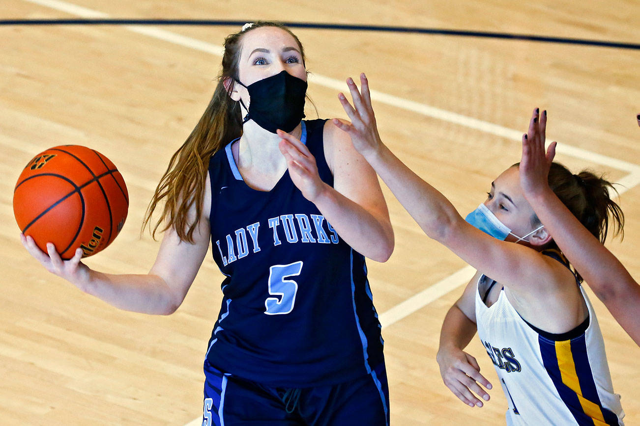 Sultan's Grace Trichler looks to score with Eastside Prep's Katelyn Miller defending Thursday afternoon at Eastside Prep in Kirkland on June 17, 2021.  (Kevin Clark / The Herald)