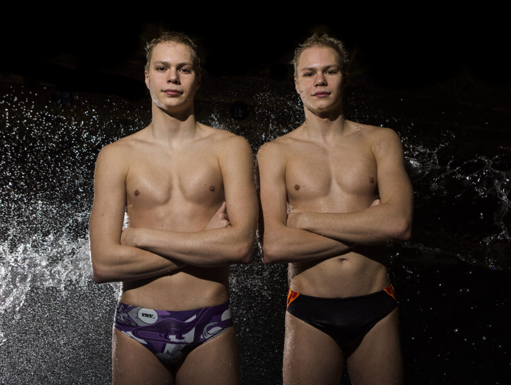 Kamiak swimmers Slava Gilszmer, left, and Vlad Gilszmer, right, at Kamiak High School on Dec. 27, 2019. (Olivia Vanni / The Herald).
