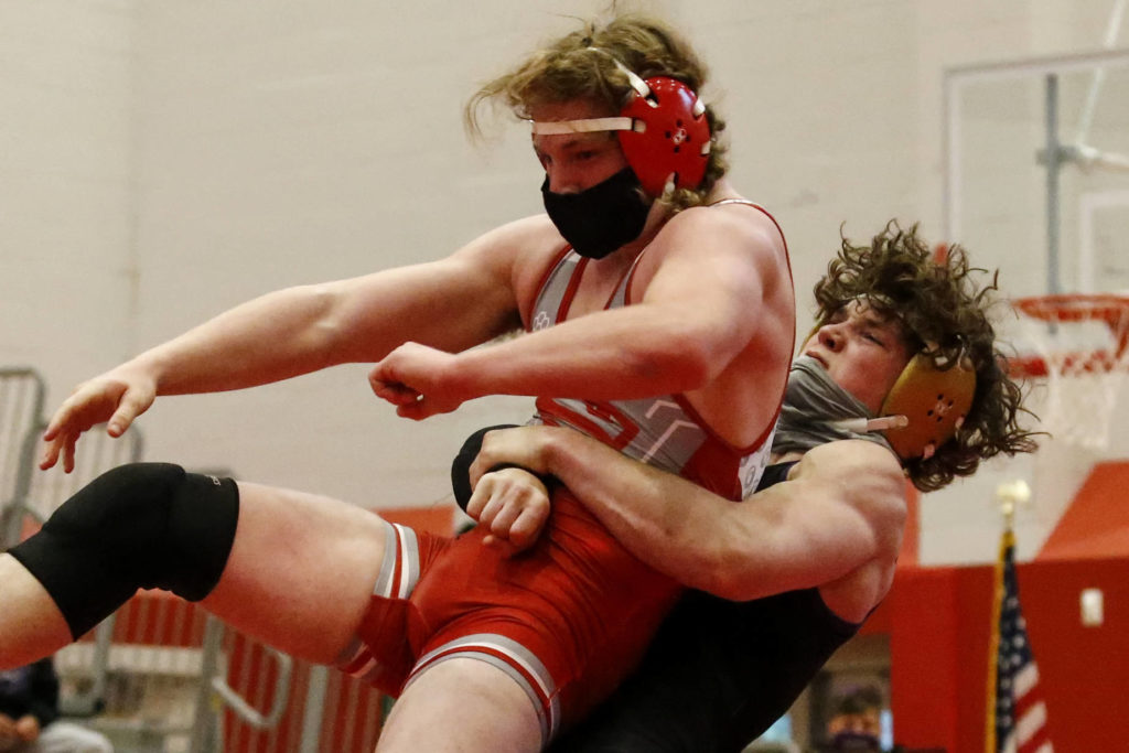 Lake Stevens’ Isiah Young wrestles Stanwood’s Mason Ferguson during a meet at Stanwood High School on May 20. (Kevin Clark / The Herald)
