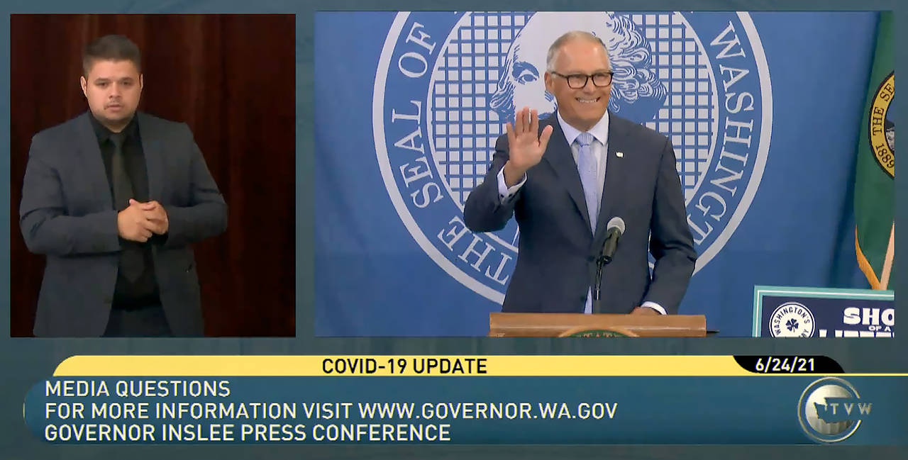 Gov. Jay Inslee waves during his Thursday morning press conference on extending protections for renters. (TVW)
