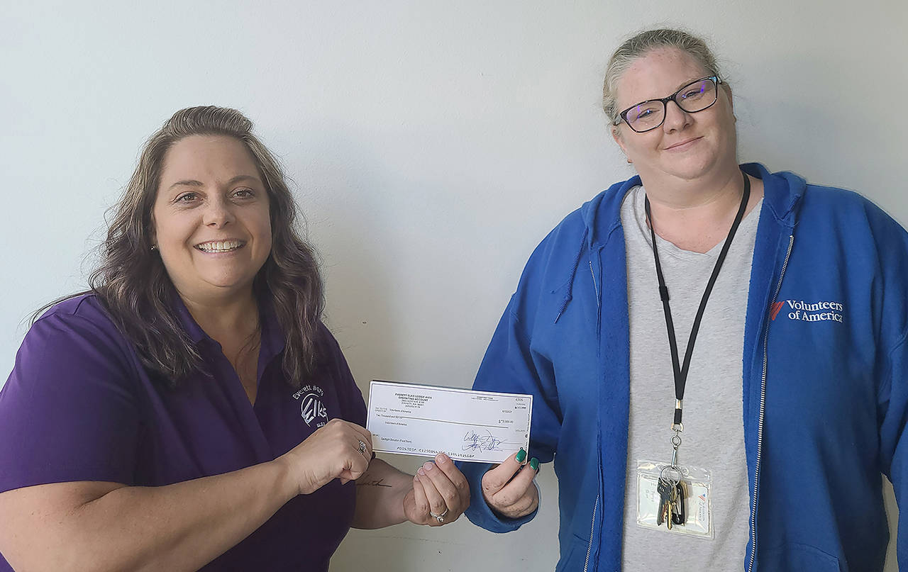Wendy Cook, Everett Elks Lodge Exalted Ruler, gave Volunteers of American Food Bank Manager Tonya Gien a check for $2,000. (Everett Elks Lodge)