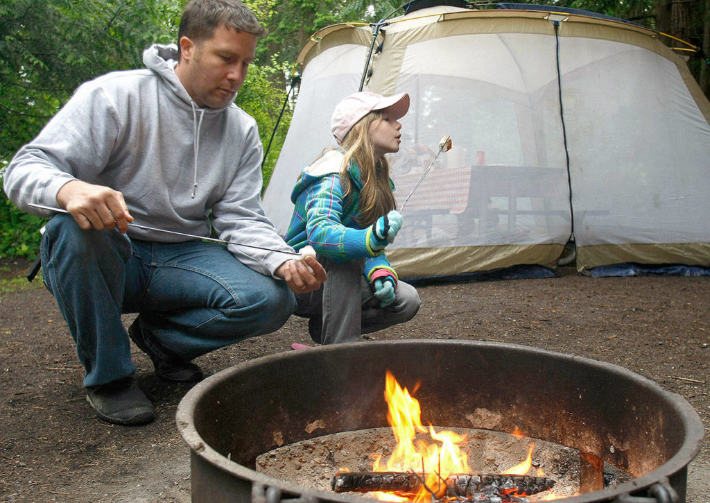 When having a campfire, use existing fire rings where available and don’t burn wood larger than the ring. (Sarah Weiser / Herald file)