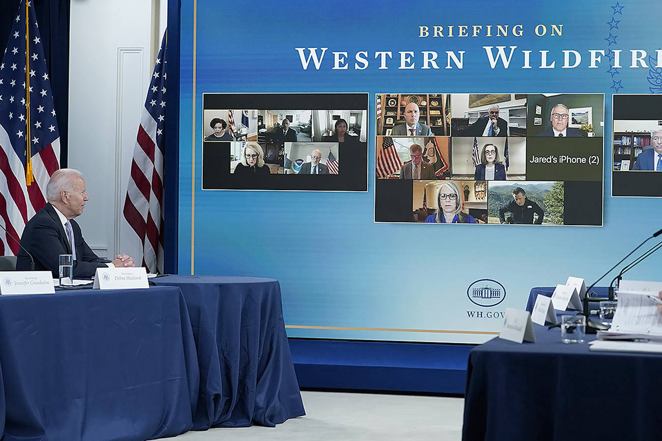 President Joe Biden, right, listens during an event in the South Court Auditorium on the White House complex in Washington, Wednesday, June 30, 2021, with cabinet officials and governors from Western states to discuss drought and wildfires. Others a the table are, from left, White House chief of staff Ron Klain, Energy Secretary Jennifer Granholm and Interior Secretary Deb Haaland. (AP Photo/Susan Walsh)