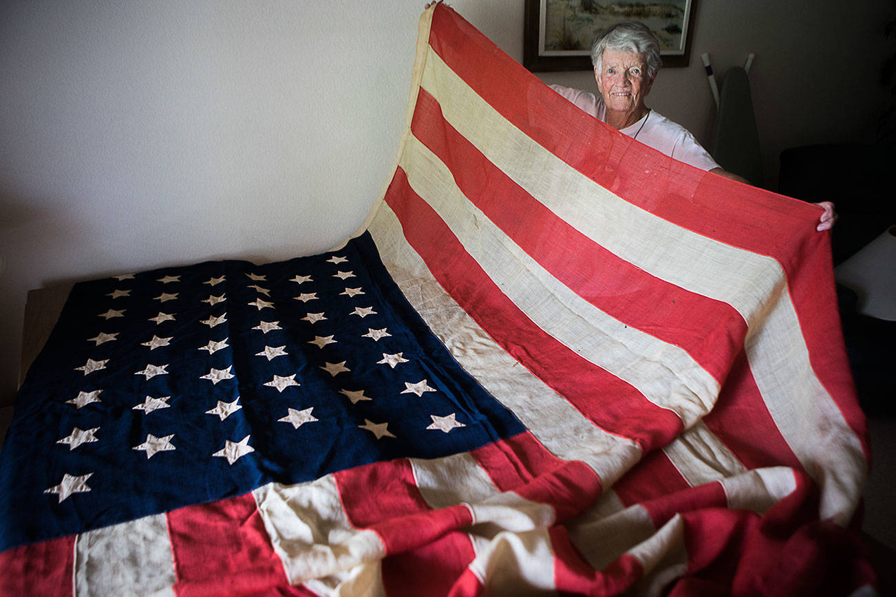 Pat Colyer with her 44-star American flag at her home on Thursday, July 1, 2021 in Mukilteo, Wa. (Olivia Vanni / The Herald)