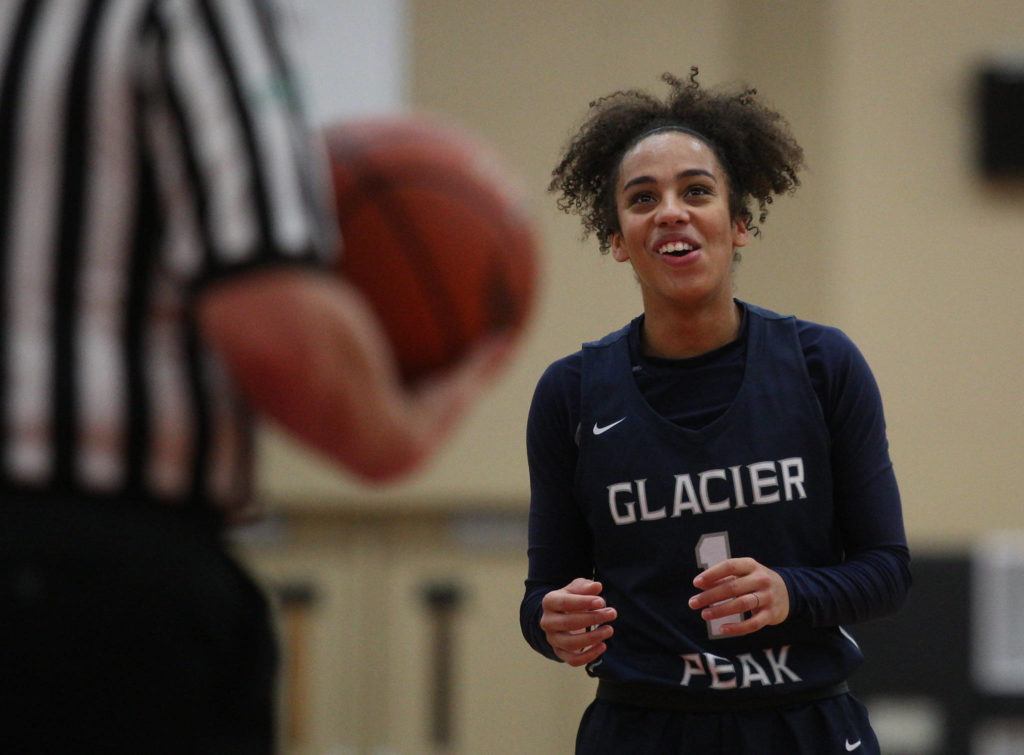 Glacier Peak’s Aaliyah Collins laughs while standing at the free-throw line during a game against Snohomish on Dec. 9, 2019 at Snohomish High School. (Andy Bronson / The Herald)
