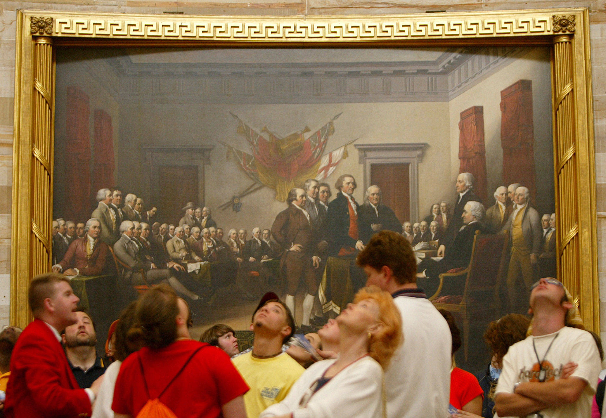 Visitors tour the Capitol Rotunda near John Trumbull’s painting titled “Declaration of Independence, July 4th, 1776,” in May 2003. On that day, the Continental Congress formally endorsed the Declaration of Independence. (Charles Dharapak / Associated Press)