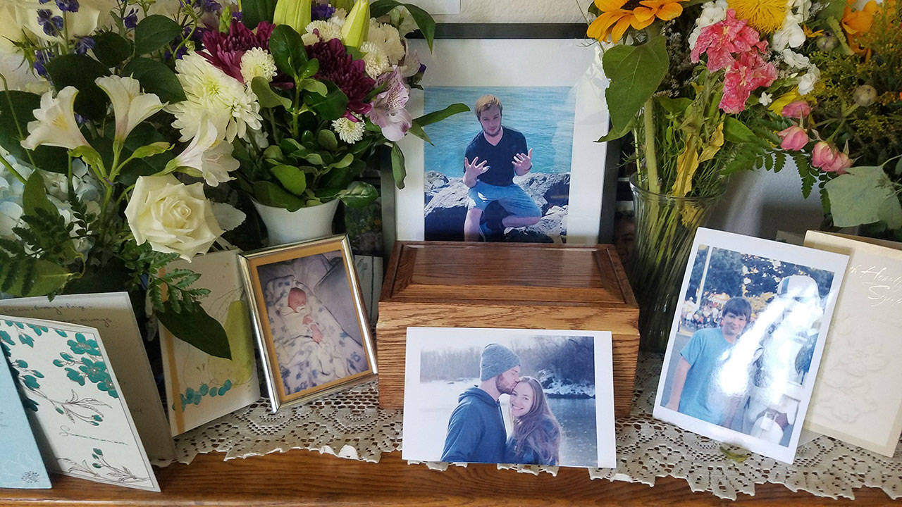 Flowers, cards and photos surround Chance Larreau’s urn. (Burlin/Larreau family)