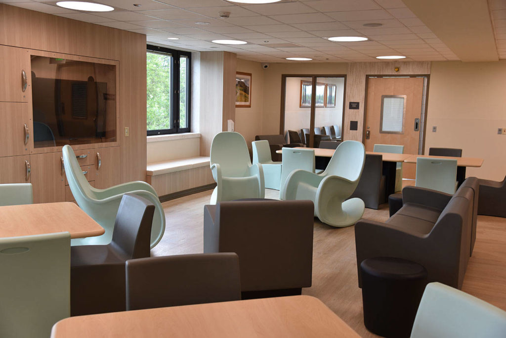 The new 24-bed inpatient behavioral health unit features rocking chairs, nature photos, and difficult to move furniture meant to avoid self-harm. It opened July 1. (Providence Regional Medical Center Everett)
