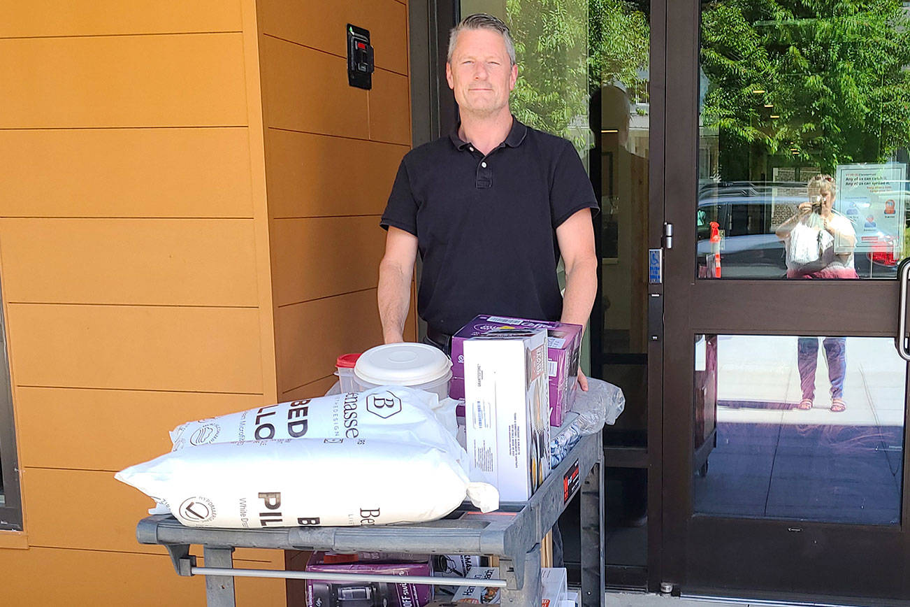 Brian Neumann, project manager for Compass Health, recently received Welcome Home packages for veteran's at the agency's new apartment complex. (Everett Elks)