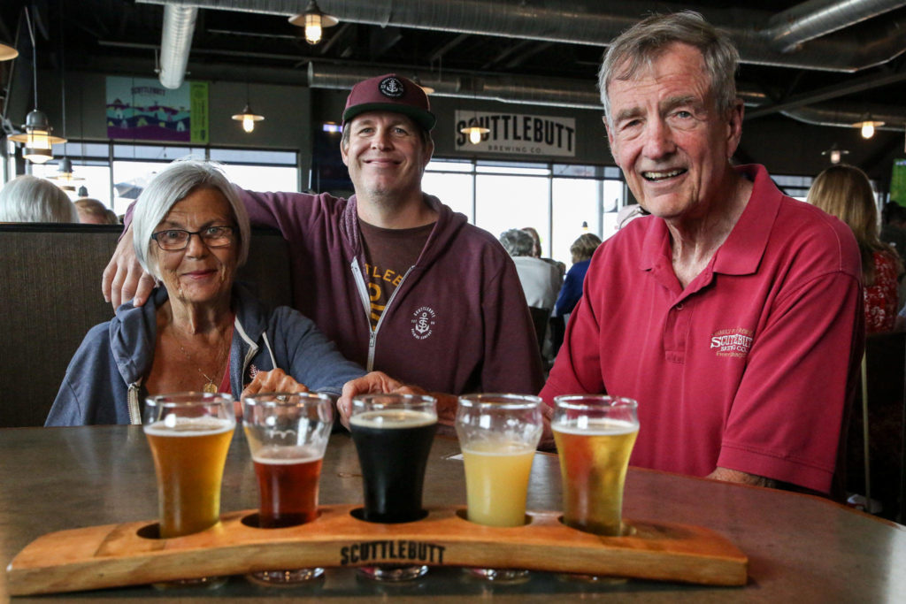 Cynthia Bannan, Phil Bannan Jr. and Phil Bannan relax at their restaurant. (Kevin Clark / The Herald)
