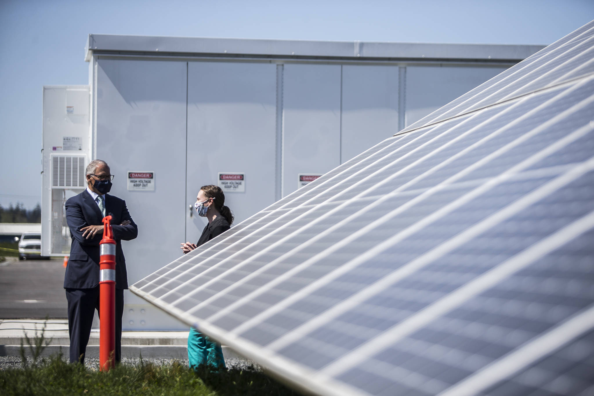 Gov. Jay Inslee walks through Snohomish County PUD’s microgrid April 20 in Arlington. (Olivia Vanni / The Herald)