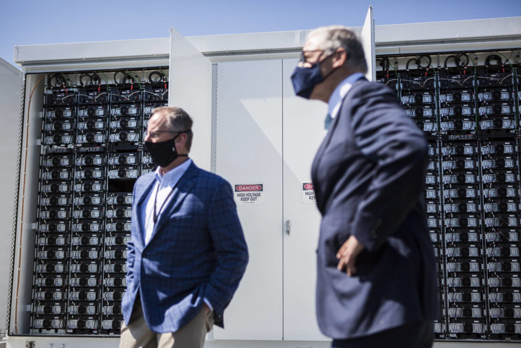 Snohomish County PUD’s innovative microgrid batteries, which will store solar power, sit in their enclosed units during a visit by Gov. Jay Inslee. (Olivia Vanni / The Herald)

