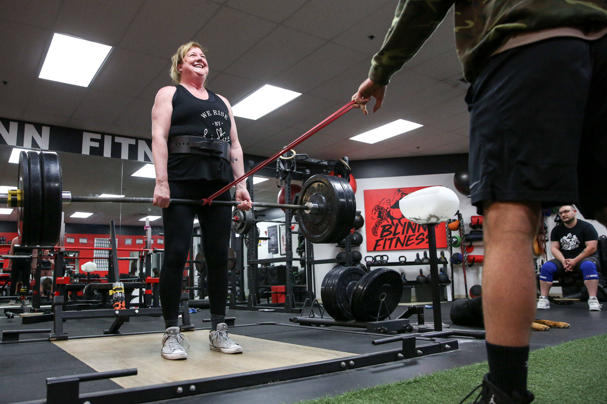 Cindy Buchan works out at Blinn Fitness in Everett on Wednesday. Buchan, 60, recently won a most-inspirational award in a weightlifting competition in Oregon, where she lifted 319 pounds. (Kevin Clark / The Herald)