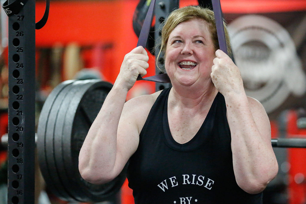 Cindy Buchan, 60, recently won a most-inspirational award in a weightlifting competition in Oregon, where she lifted 319 pounds. (Kevin Clark / The Herald)
