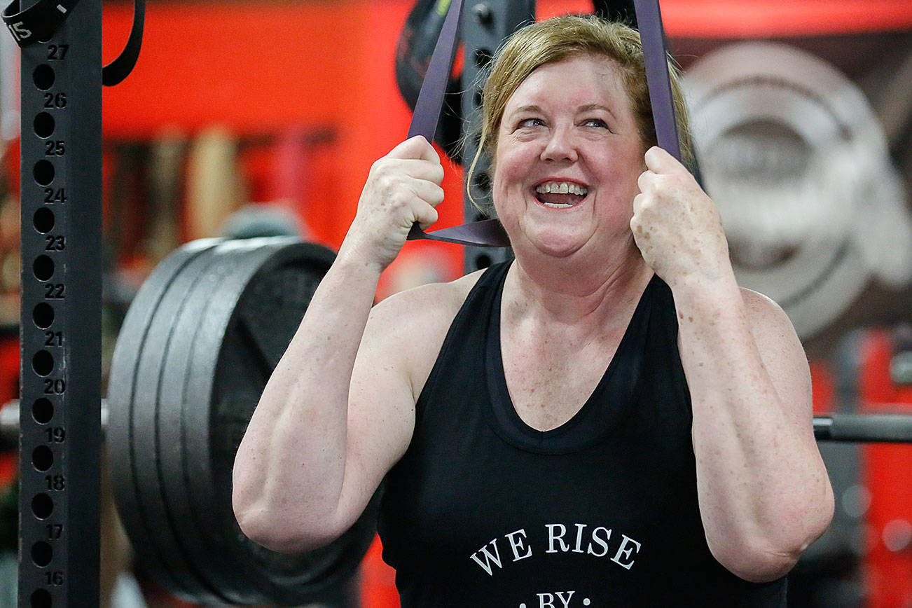 Cindy Buchan, 60, recently won a most-inspirational award in a weightlifting competition in Oregon, where she lifted 319 pounds. (Kevin Clark / The Herald)