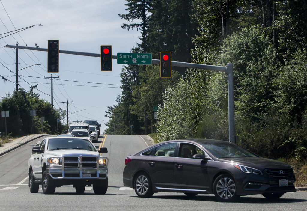 From 30th Street, drivers wait Friday in the intersection to head north on Highway 9 in Snohomish. (Olivia Vanni / The Herald)
