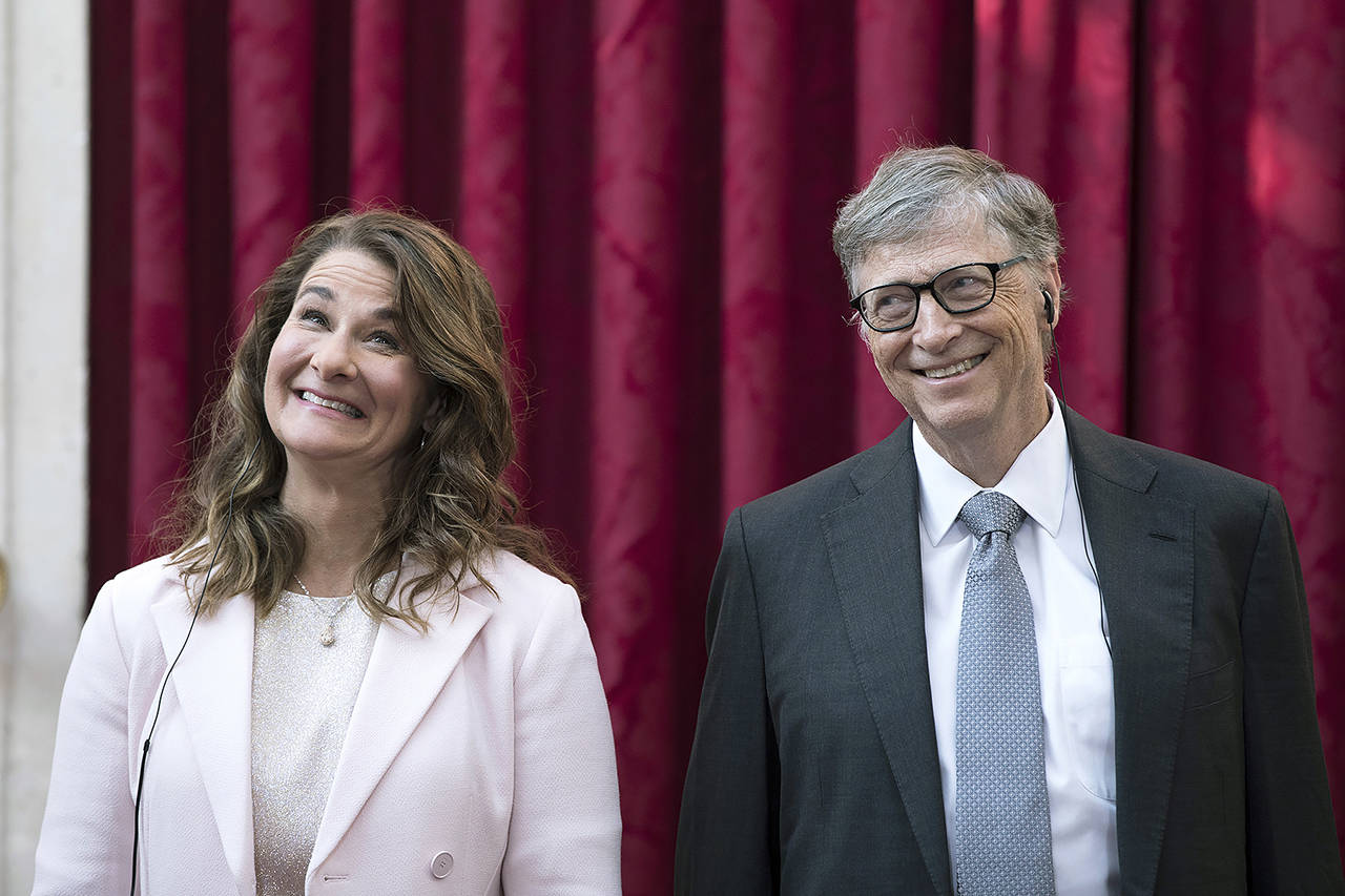 In this 2017 photo, Bill Gates and his wife, Melinda, react to being awarded the Legion of Honour at the Elysee Palace in Paris. (AP Photo/Kamil Zihnioglu, Pool file)