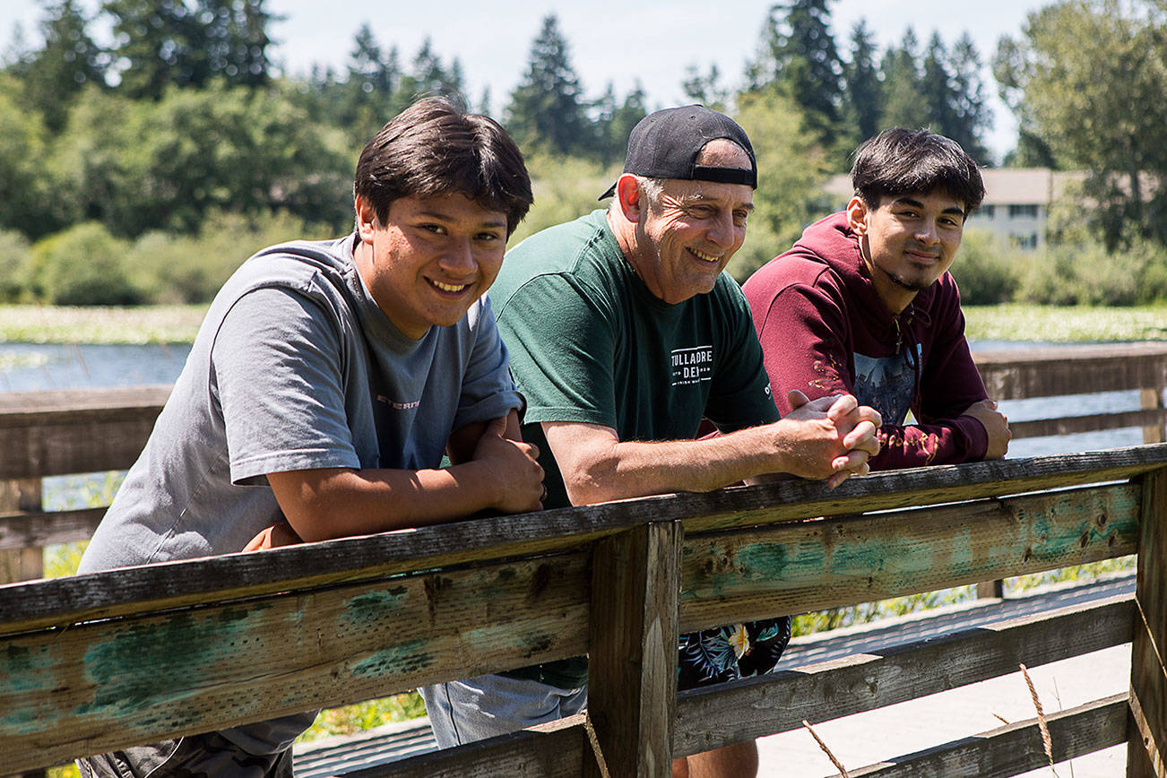 Arturo Salinas, 16, left, Ed Newsom, 63, and Johnryan Newsom, 16 were all together when Ed Newsom was pulled under a log while floating the Green River in Auburn where Arturo Salinas and Johnryan performed life saving measures to revive Ed Newsom. (Olivia Vanni / The Herald)